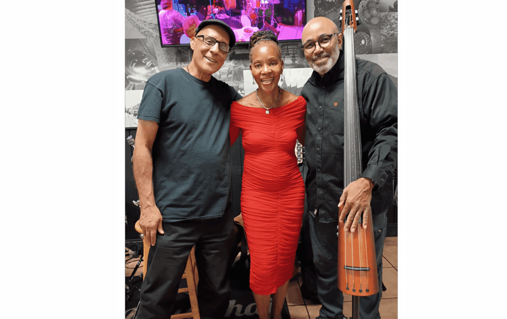 Sabrina posing with band members, Left-to-Right-Barry-Sabrina-Kirk